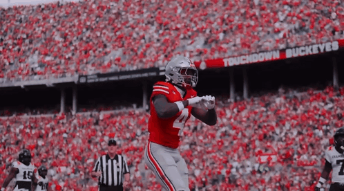 Football Player in Red Uniform Running