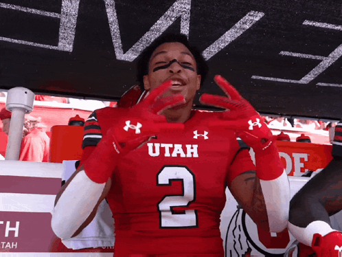 Football Player in Red Utah Jersey Number 2