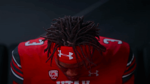 Football Player in Red Utah Uniform