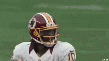 Football Player In Redskins Helmet Holding Football GIF