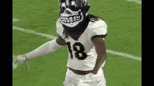 Football Player in Skull Bandana Dancing on Field