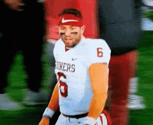 Football Player in Sooners Jersey on Field