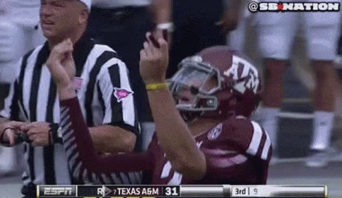 Football Player in Texas A&M Helmet Celebrating Touchdown