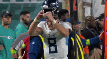 Football Player In Titans Jersey Helped Off Field By Doctor GIF