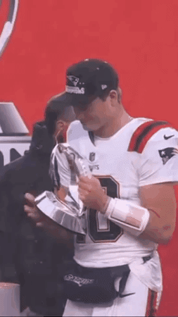 Football Player In White Jersey Holding Trophy GIF