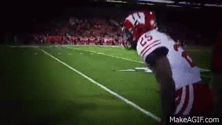 Football Player in White Jersey Number 23
