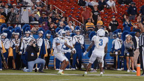 Football Player in White Jersey Number 3