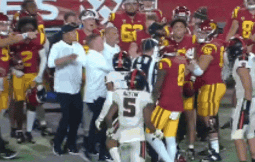 Football Player in White Jersey with Number 5