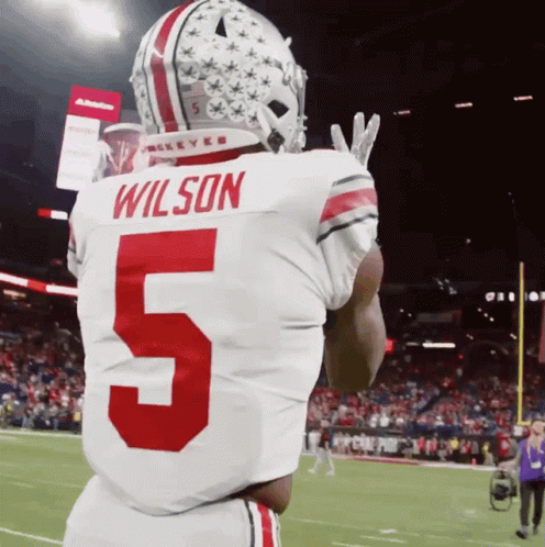 Football Player in White Jersey With Wilson