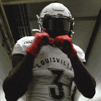 Football Player in White Louisville Jersey
