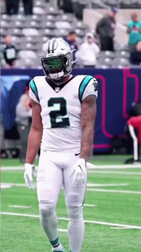 Football Player in White Uniform and Helmet