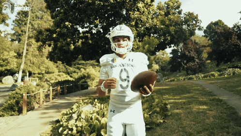 Football Player in White Uniform Number 9