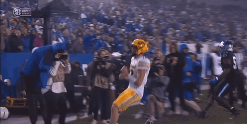 Football Player in Yellow Helmet Number 11