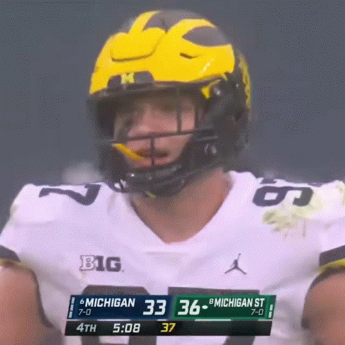 Football Player in Yellow Helmet Number 33