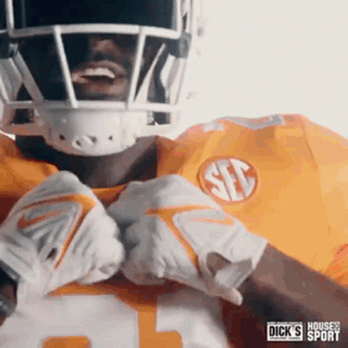 Football Player In Yellow Jersey And Gloves GIF