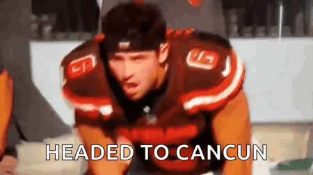 Football Player Kneeling With Headed To Cancun GIF