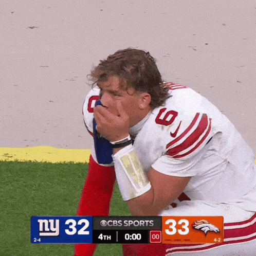 Football Player Kneeling With Score