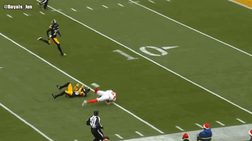 Football Player Laying on Field With Royals Jun