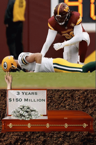 Football Player Laying on Field With Sign Saying 3 Years $150 Million
