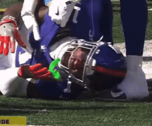 Football Player Laying With Yellow Side Sign GIF