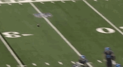 Football Player Lying on Field Referee Watching