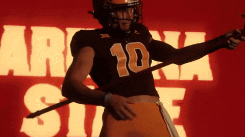 Football Player Number 10 Holding Stick