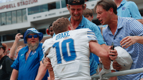 Football Player Number 10 Hugged By Fans