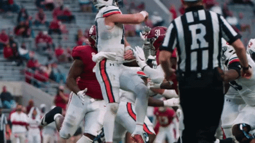 Football Player Number 10 Kneeling GIF