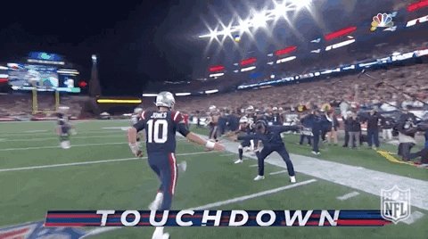 Football Player Number 10 Running on Field