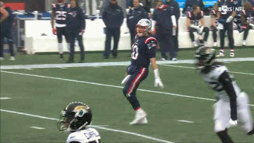 Football Player Number 10 Running on Field
