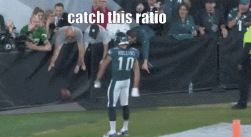 Football Player Number 10 Standing on Field