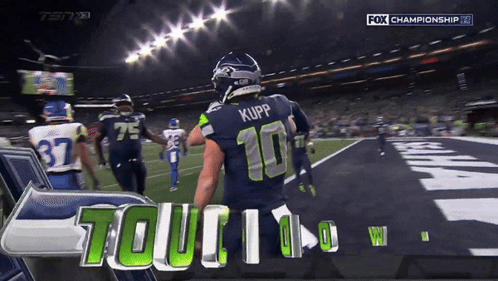 Football Player Number 10 Standing On Field GIF