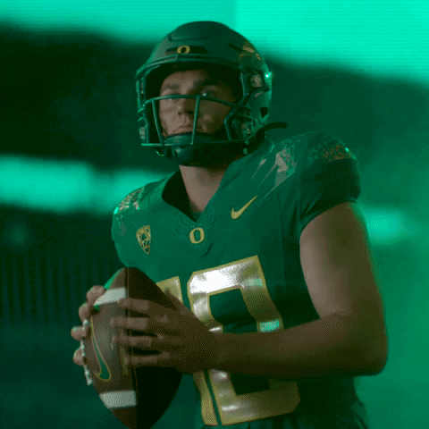 Football Player Number 10 Throwing Ball