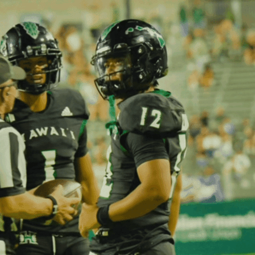 Football Player Number 12 Talking to Referee