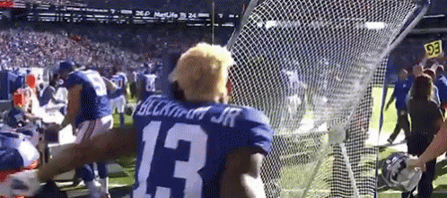 Football Player Number 13 in Front of Net