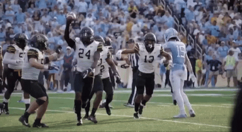 Football Player Number 13 Running