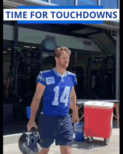 Football Player Number 14 Carrying Helmet GIF