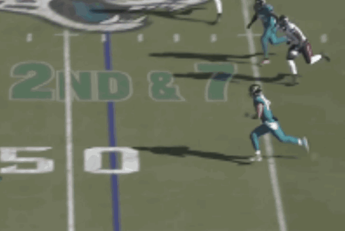 Football Player Number 15 Laying On Ground GIF