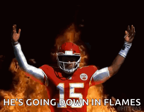 Football Player Number 15 Standing In Front Of Flames GIF