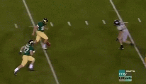 Football Player Number 16 Being Tackled