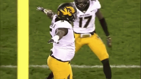 Football Player Number 17 Being Tackled