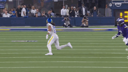 Football Player Number 17 Running on Field