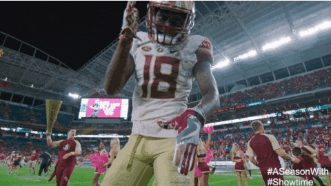 Football Player Number 18 Celebrating on Field
