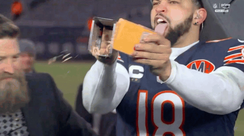 Football Player Number 18 Holding Cheese Box