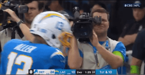 Football Player Number 19 Being Photographed GIF