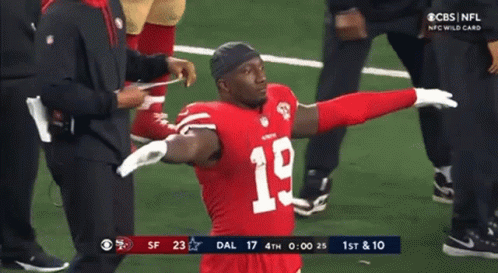 Football Player Number 19 With Arms Outstretched