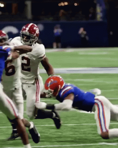 Football Player Number 2 Being Tackled