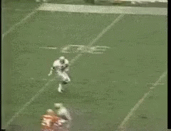 Football Player Number 2 Being Tackled