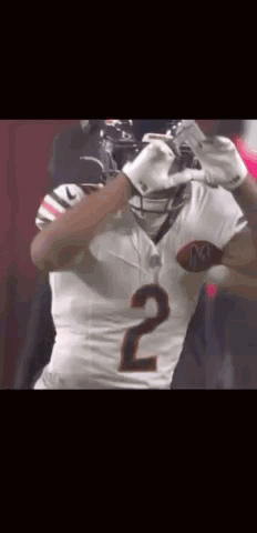Football Player Number 2 Holding Football