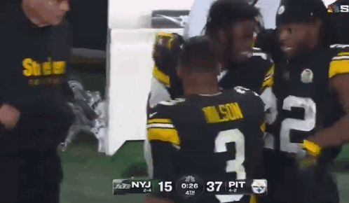 Football Player Number 2 Hugging Another Player GIF
